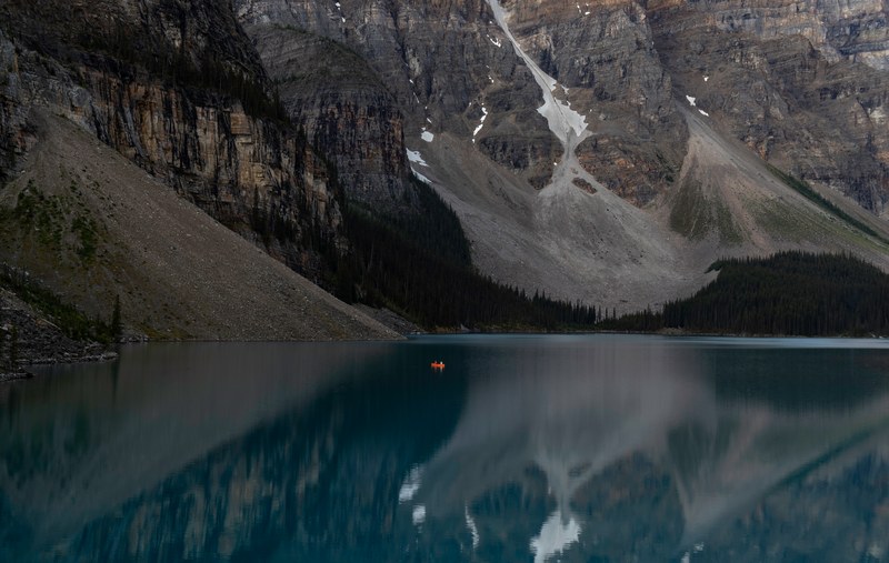 A mountain reflected in a still lake.